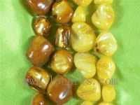 16" teeth yellow and coffee shell strand